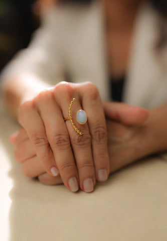 Gold rainbow moonstone half moon statement ring