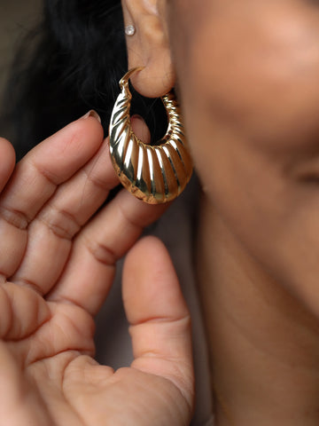 Gold plated textured oval hoop earrings