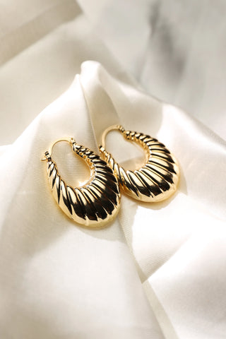 Gold plated textured oval hoop earrings