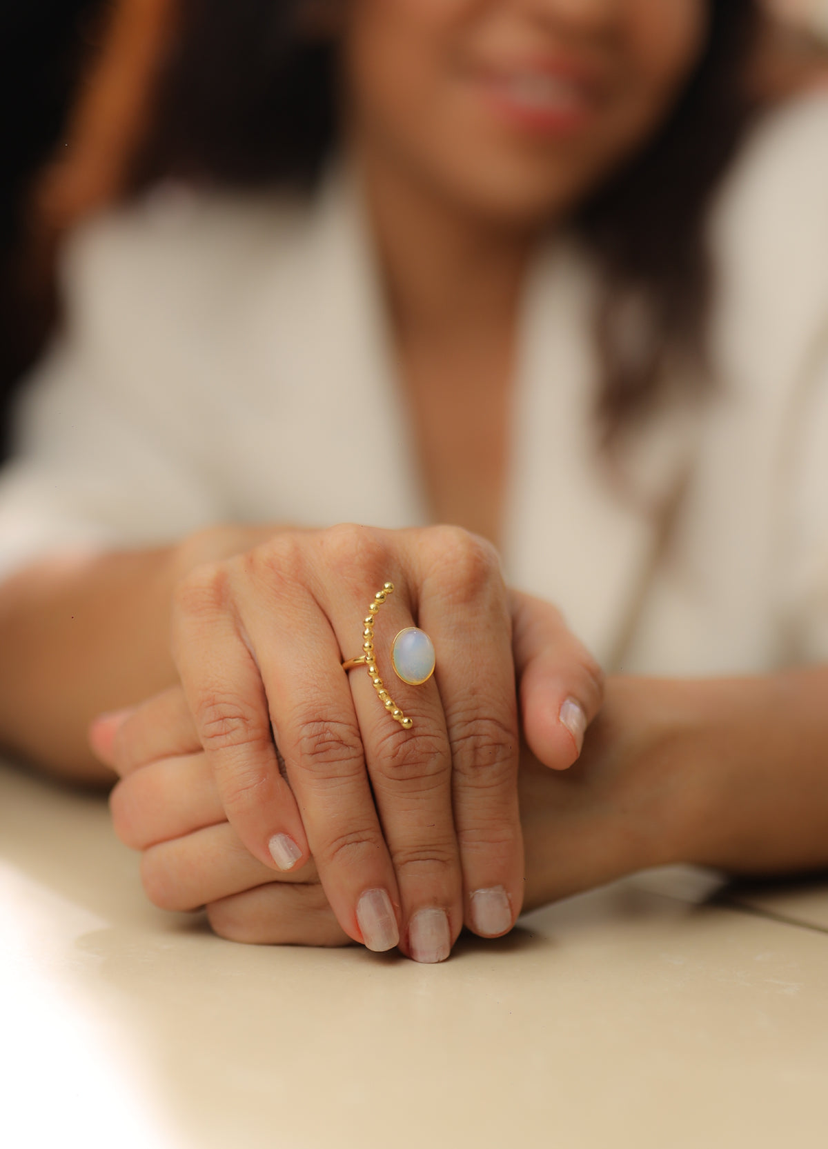 Gold rainbow moonstone half moon statement ring